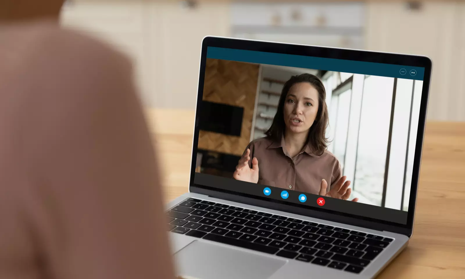 Woman in video meeting on laptop