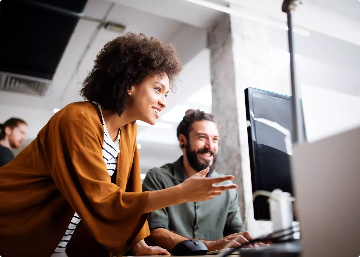 Man and woman looking at computer